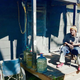 A resident of Sandbranch sits on his porch with water jugs nearby.
Strategic Vision and Plan for Improvements to the Sandbranch Community
